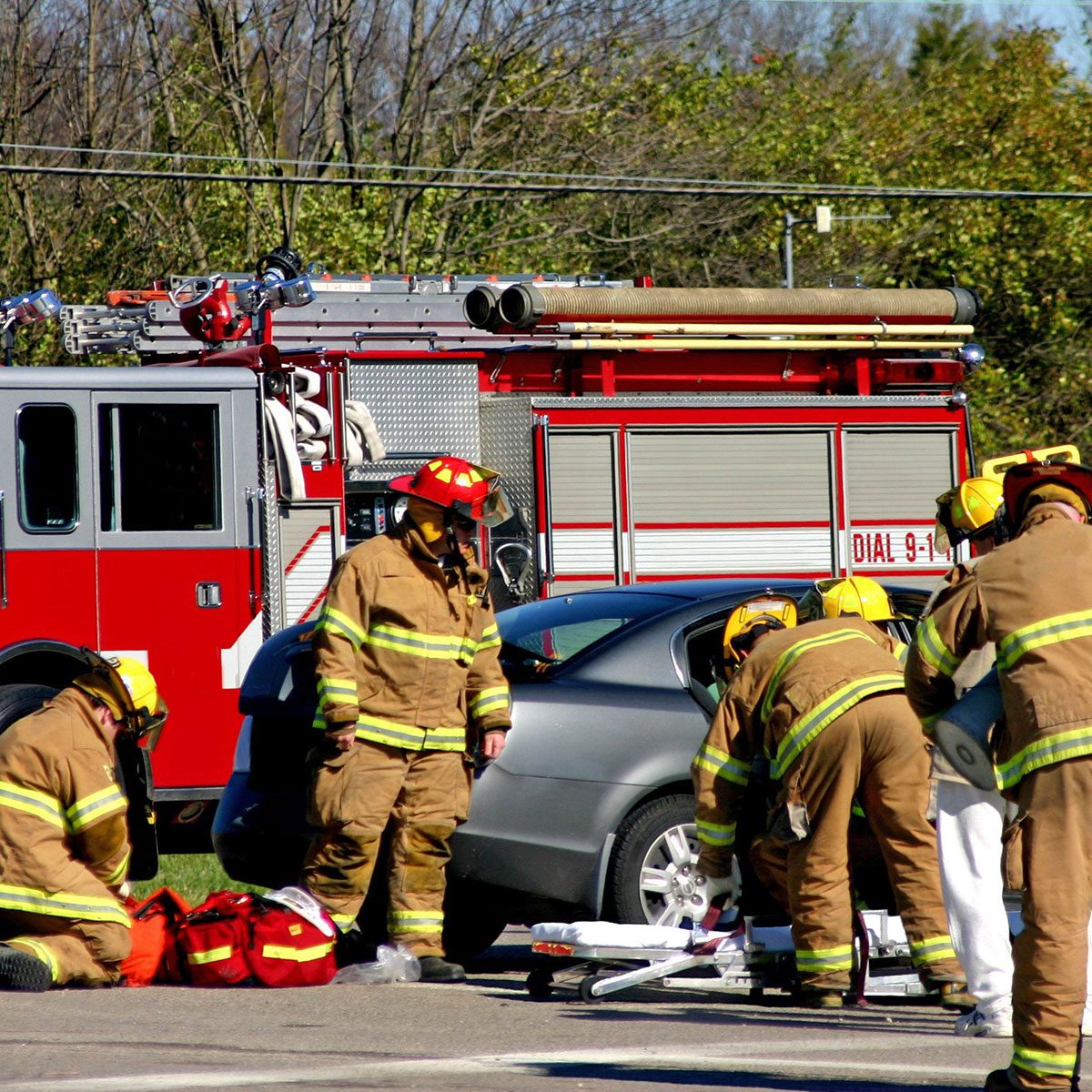 Fire fighters at work on the scene of accident Fire fighters at work on the scene of accident